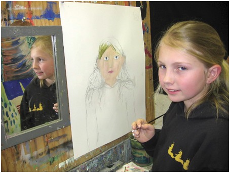 young art student with self portrait